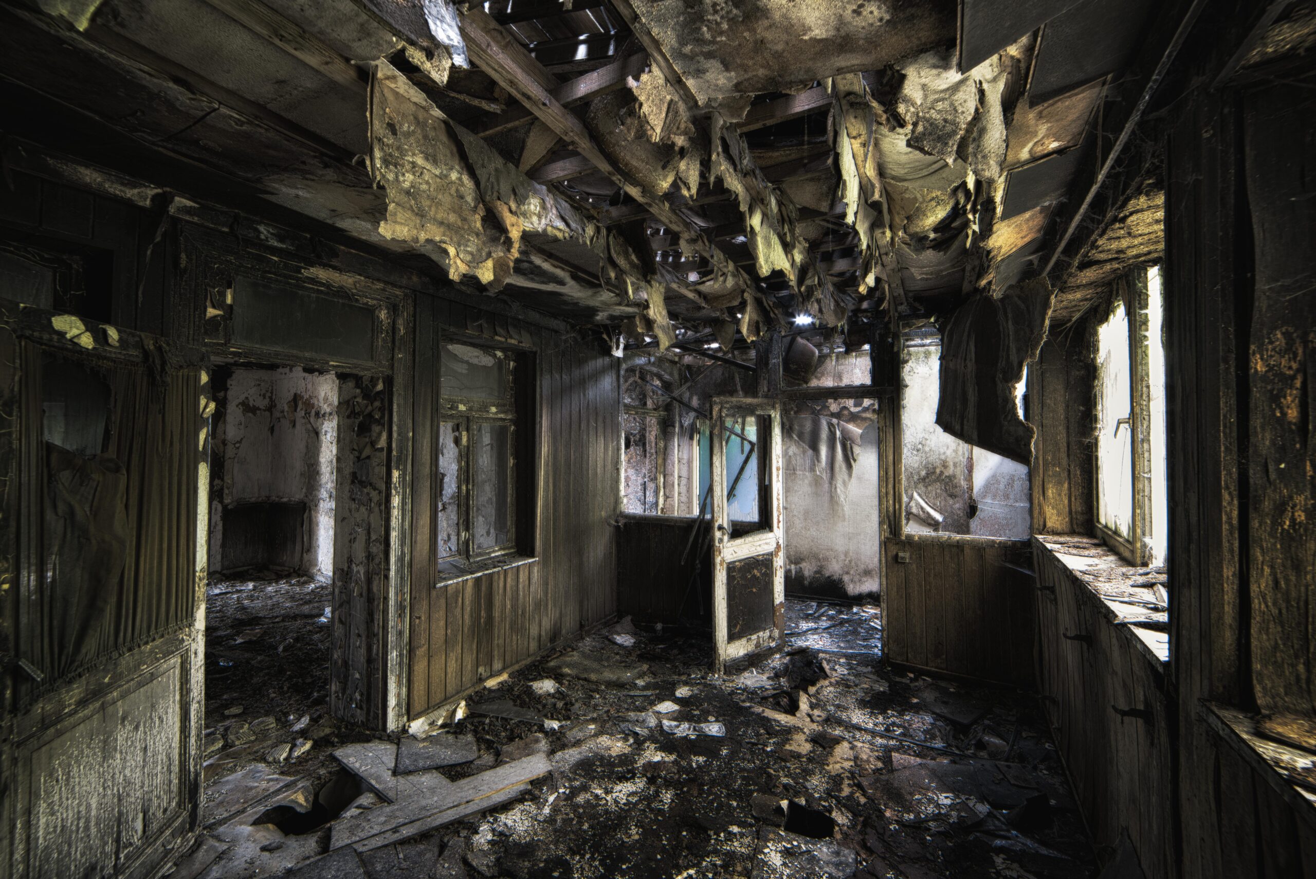 inside shot abandoned destroyed building with burned walls worn out doors scaled